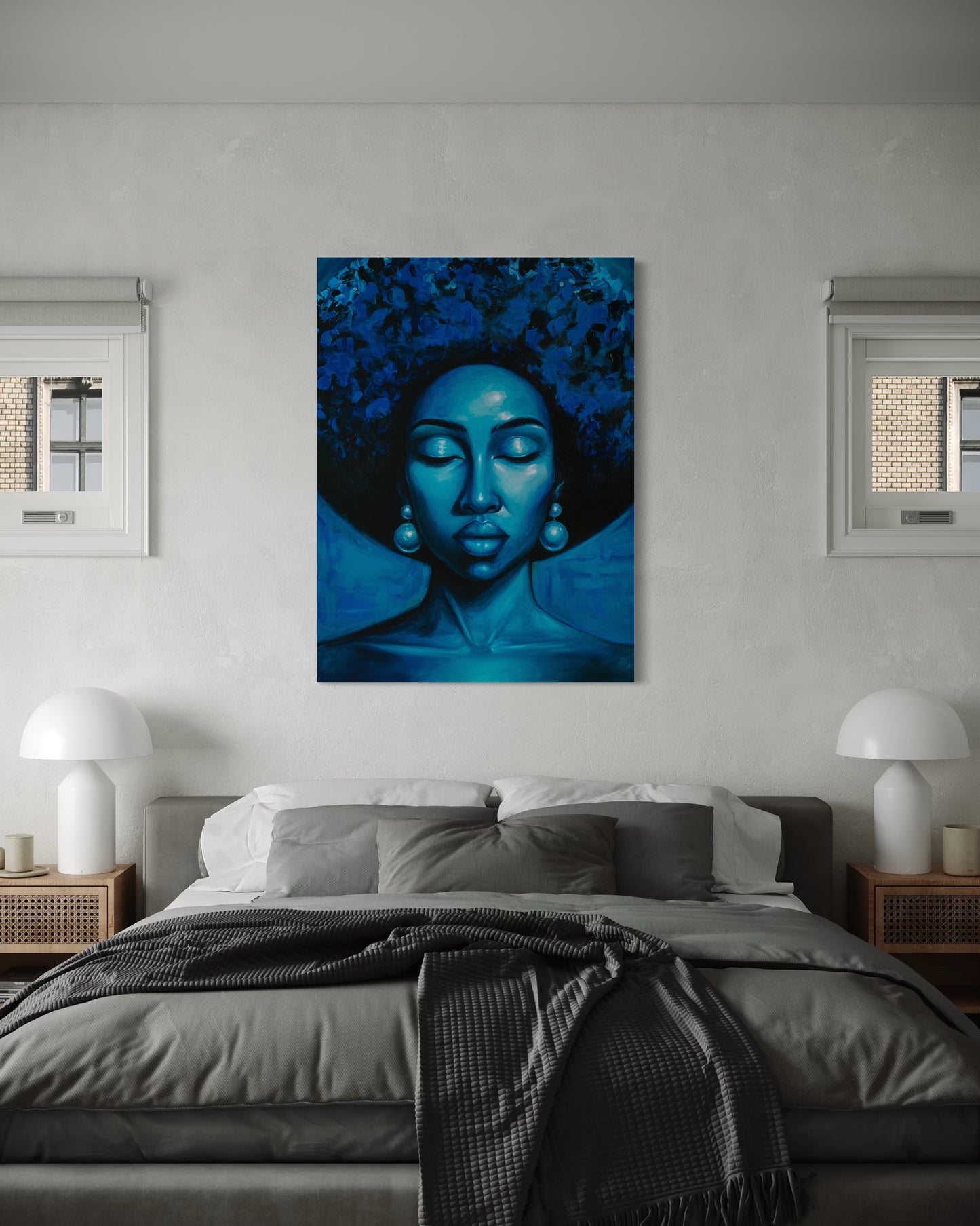 Inward blue portrait displayed above modern bedroom